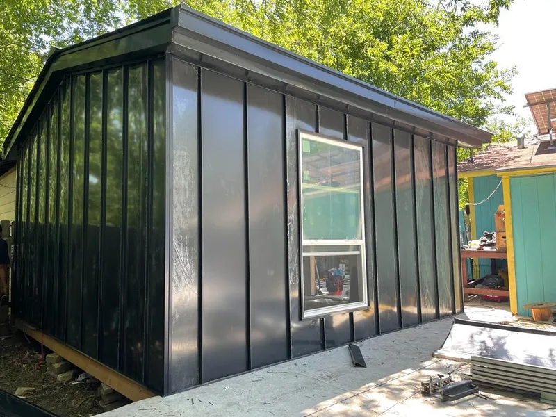 Black standing seam metal wall panels for Roof Inspection in Cherokee